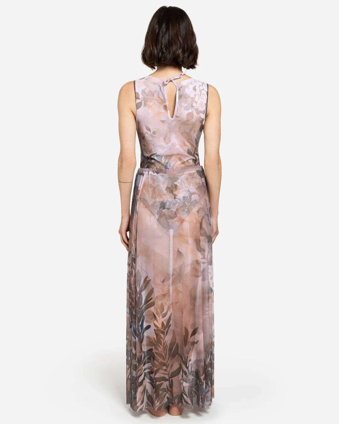 Designer maxi sheer beach skirt with a botanical leaf print in muted tones of dusty pink, taupe, brown, and soft blue-gray | RODA