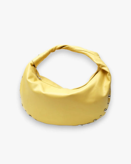 Designer bright yellow slouchy shoulder bag with a twisted top handle and silver metal studs along the edges | ALLBYB