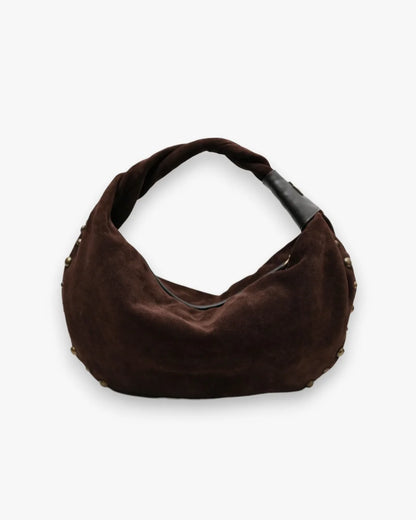 Designer brown slouchy shoulder bag with a twisted top handle and gold metal studs along the edges | ALLBYB