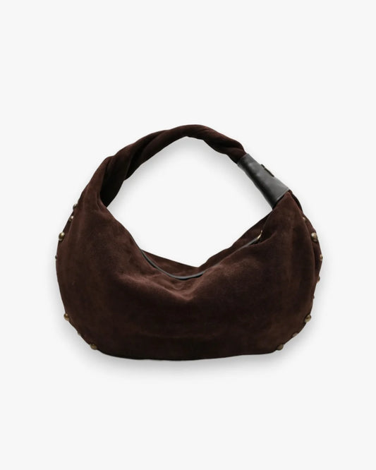 Designer brown slouchy shoulder bag with a twisted top handle and gold metal studs along the edges | ALLBYB