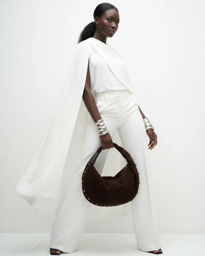 Designer brown slouchy shoulder bag with a twisted top handle and gold metal studs along the edges | ALLBYB