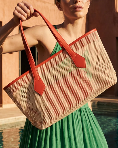 Structured designer mesh tote bag with a warm beige body and bright coral-red handles and trim | ALLBYB