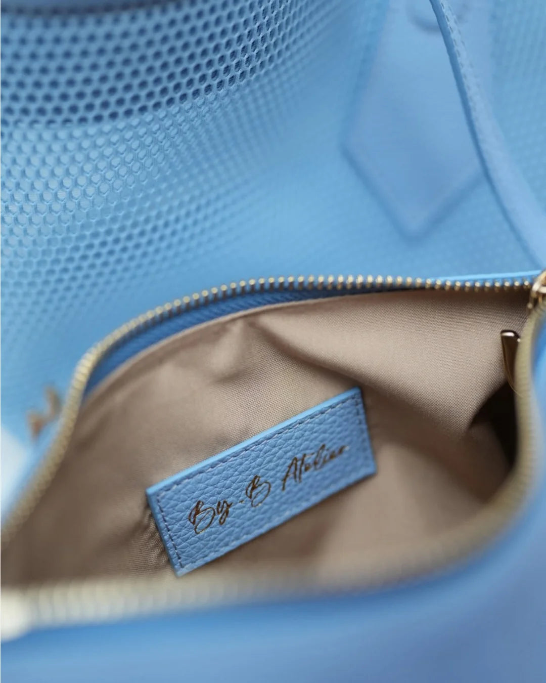 Structured designer mesh tote bag with a blue body, handles and trim | ALLBYB