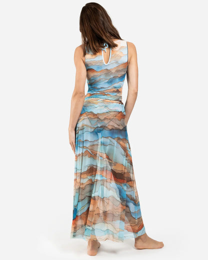 Designer maxi sheer beach skirt with a scenic abstract print of blue, orange, and beige mountains | RODA