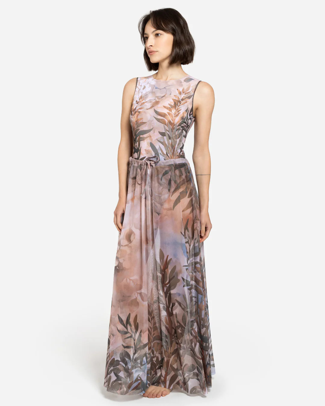 Designer maxi sheer beach skirt with a botanical leaf print in muted tones of dusty pink, taupe, brown, and soft blue-gray | RODA