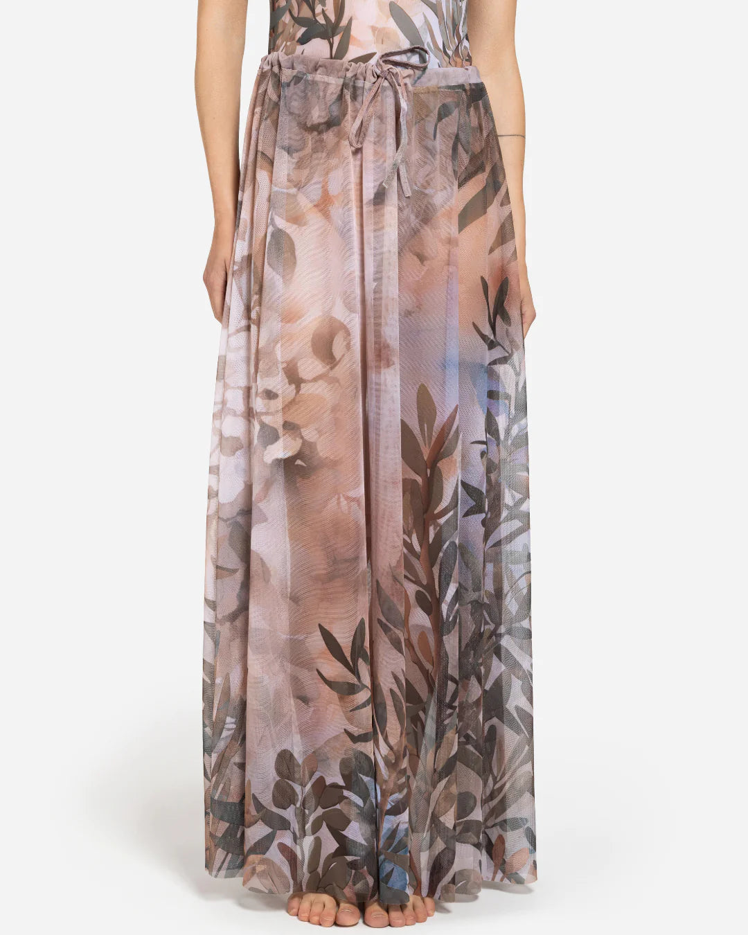 Designer maxi sheer beach skirt with a botanical leaf print in muted tones of dusty pink, taupe, brown, and soft blue-gray | RODA