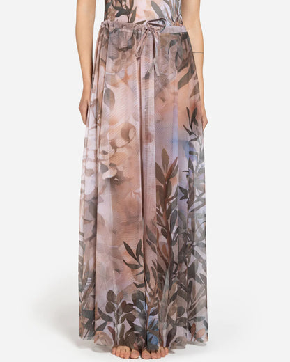 Designer maxi sheer beach skirt with a botanical leaf print in muted tones of dusty pink, taupe, brown, and soft blue-gray | RODA