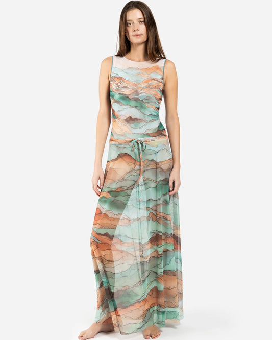 Designer maxi sheer beach skirt with a watercolor-style abstract landscape print in shades of teal, peach, orange, and beige | RODA