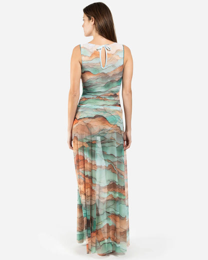 Designer maxi sheer beach skirt with a watercolor-style abstract landscape print in shades of teal, peach, orange, and beige | RODA