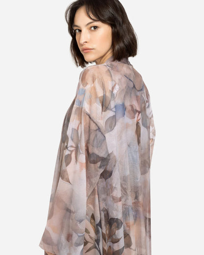Designer sheer beach robe with a botanical leaf print in muted tones of dusty pink, taupe, brown, and soft blue-gray | RODA