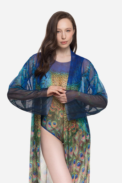 Designer long-sleeved sheer maxi beach robe with a vibrant peacock feather print, featuring a blue gradient top and a green patterned bottom | RODA