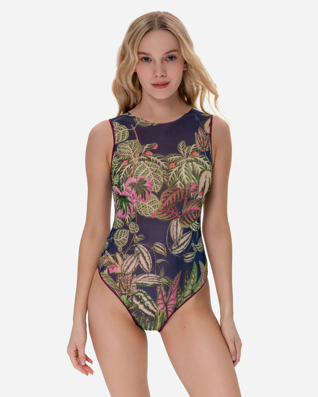 Designer sleeveless one-piece swimsuit with a detailed tropical leaf print on a dark navy blue background | RODA