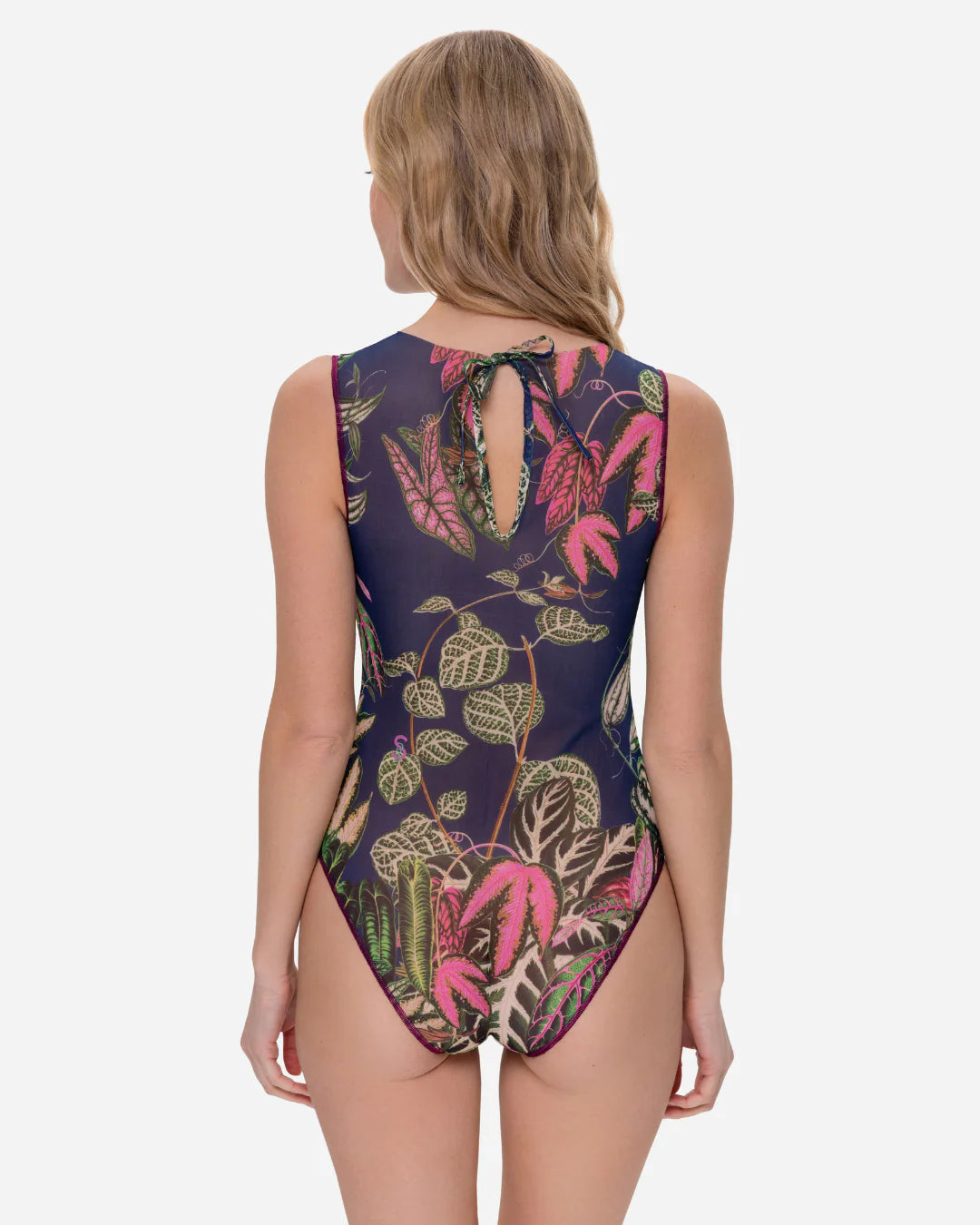 Designer sleeveless one-piece swimsuit with a detailed tropical leaf print on a dark navy blue background | RODA