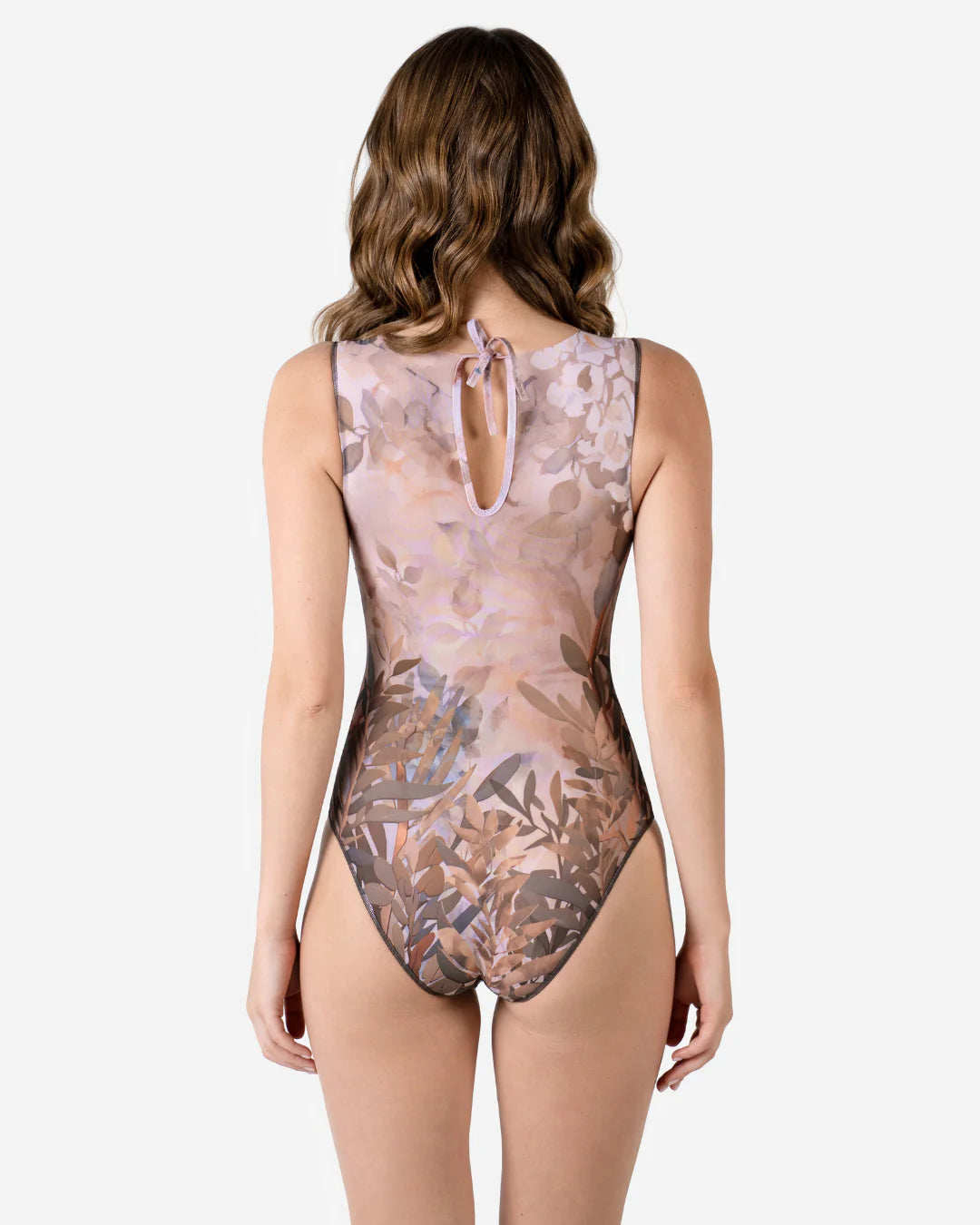 Designer sleeveless one-piece swimsuit with an abstract botanical leaf pattern in muted pink, brown, and gray tones | RODA