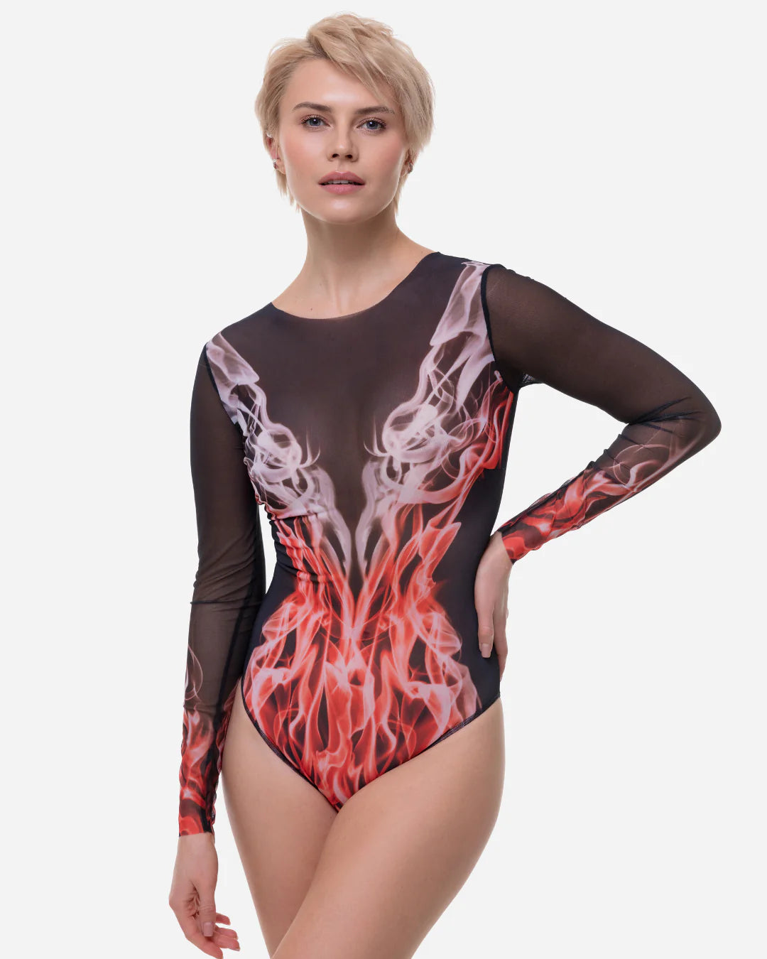 Designer long-sleeve one-piece swimsuit with a sheer black mesh upper body and sleeves, transitioning into a red, orange, and white flame-like graphic print on the lower torso and sleeves | RODA