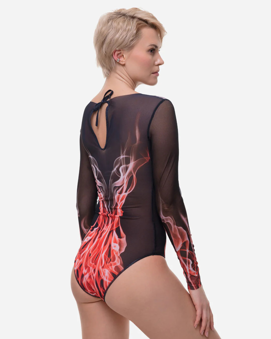 Designer long-sleeve one-piece swimsuit with a sheer black mesh upper body and sleeves, transitioning into a red, orange, and white flame-like graphic print on the lower torso and sleeves | RODA