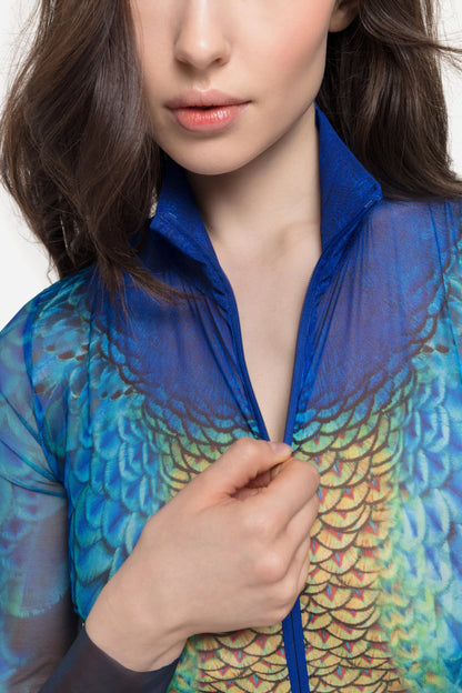 Designer long-sleeve swimsuit with a high collar and a front zipper, featuring a vibrant peacock feather and gold scale pattern in shades of blue, green, yellow, and orange | RODA
