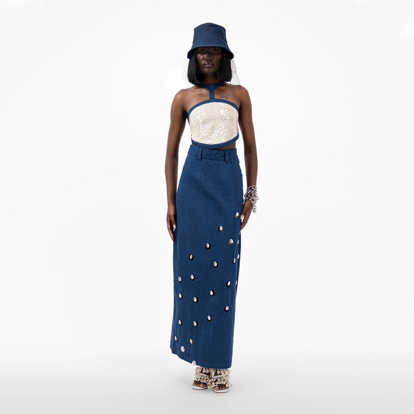 Designer Cowrie Detail Denim Maxi Skirt in Blue color | ÚCHÈ
Designer Sequin Denim Detail Crop Top in Cream color with Blue denim detail | ÚCHÈ
