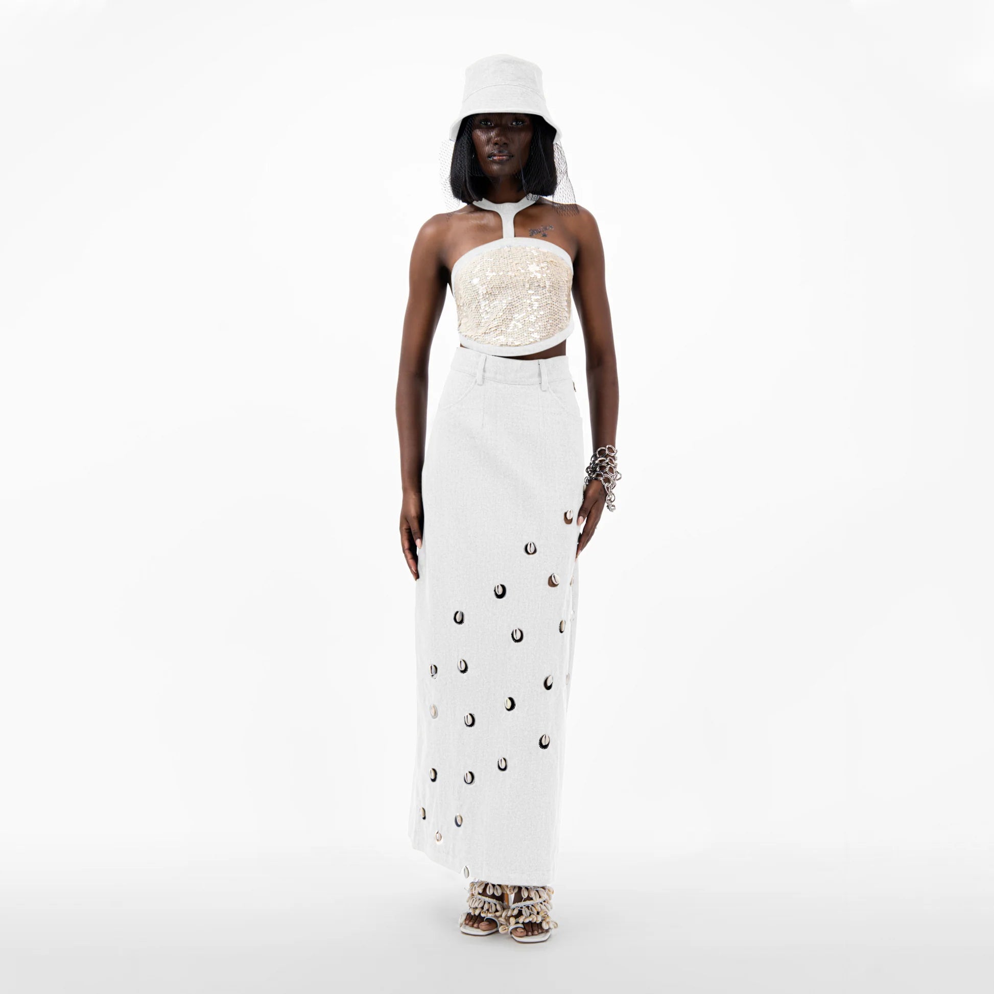 Designer Cowrie Detail Denim Maxi Skirt in White color | ÚCHÈ
Designer Sequin Denim Detail Crop Top in Cream color with White denim detail | ÚCHÈ