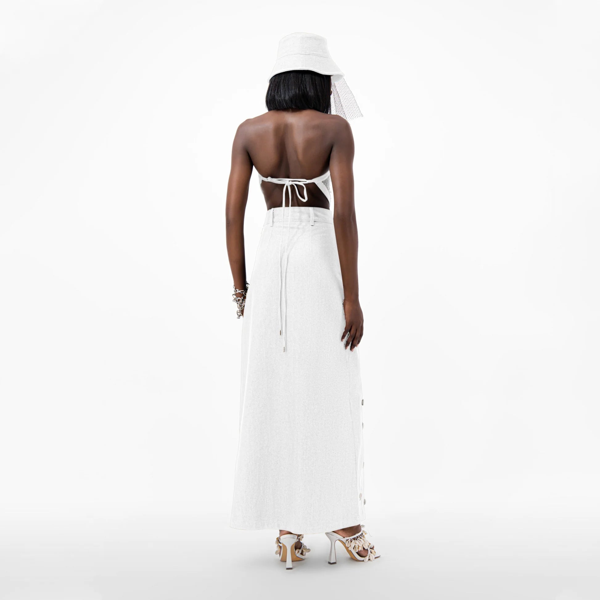 Designer Cowrie Detail Denim Maxi Skirt in White color | ÚCHÈ
Designer Sequin Denim Detail Crop Top in Cream color with White denim detail | ÚCHÈ